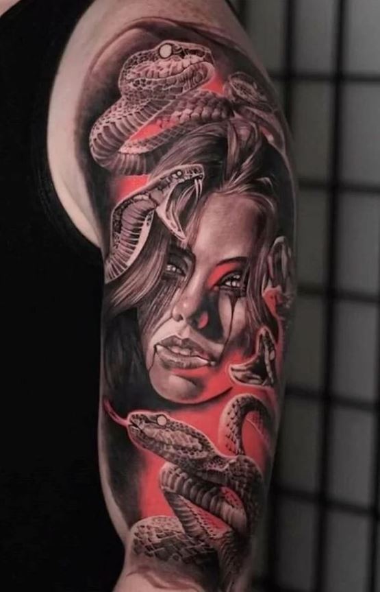Tattoo with several snakes and a woman 