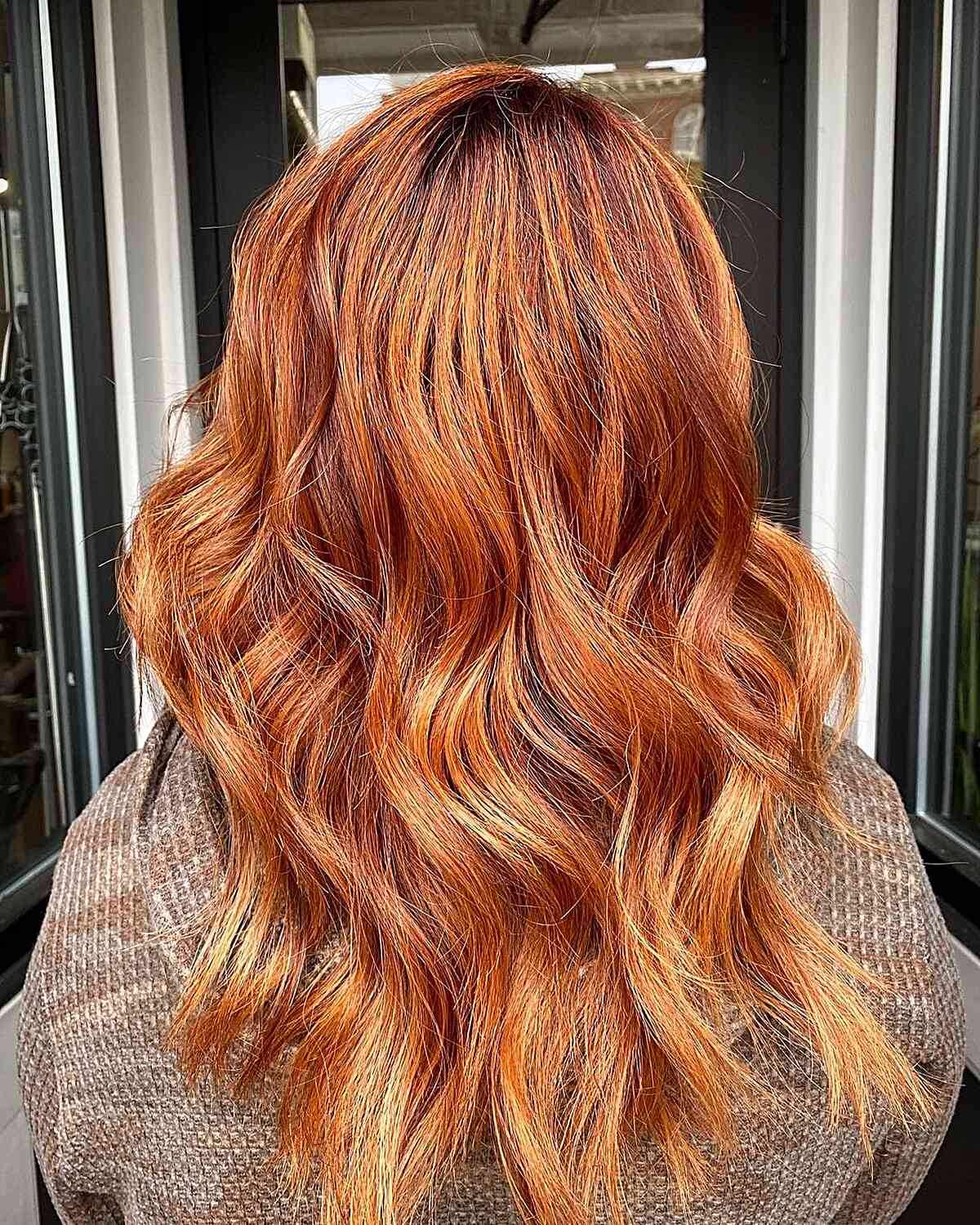 Melted ginger-copper color and low strands with soft medium waves 