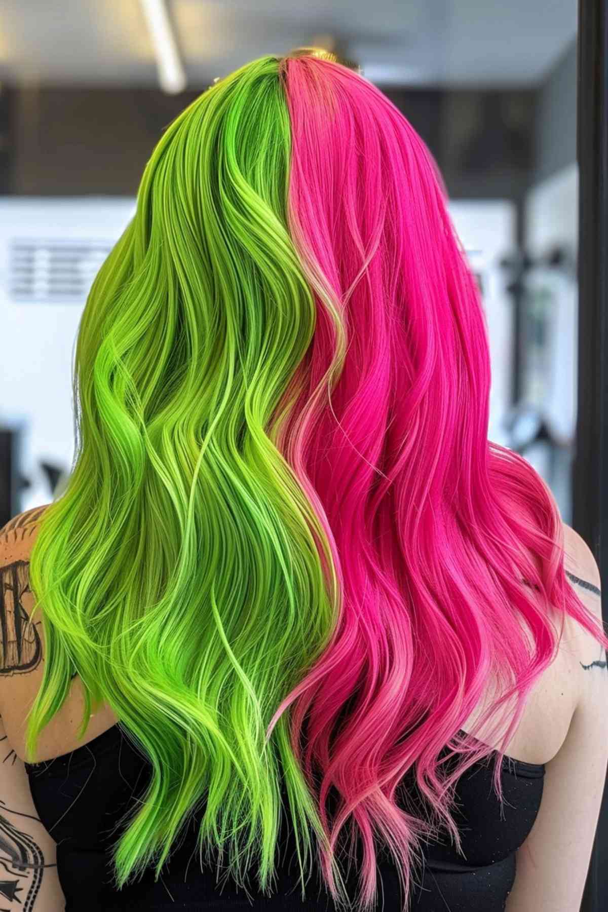 Hair dyed bright green and pink, sleek, mid-back length, highlighting the duality of Gemini.