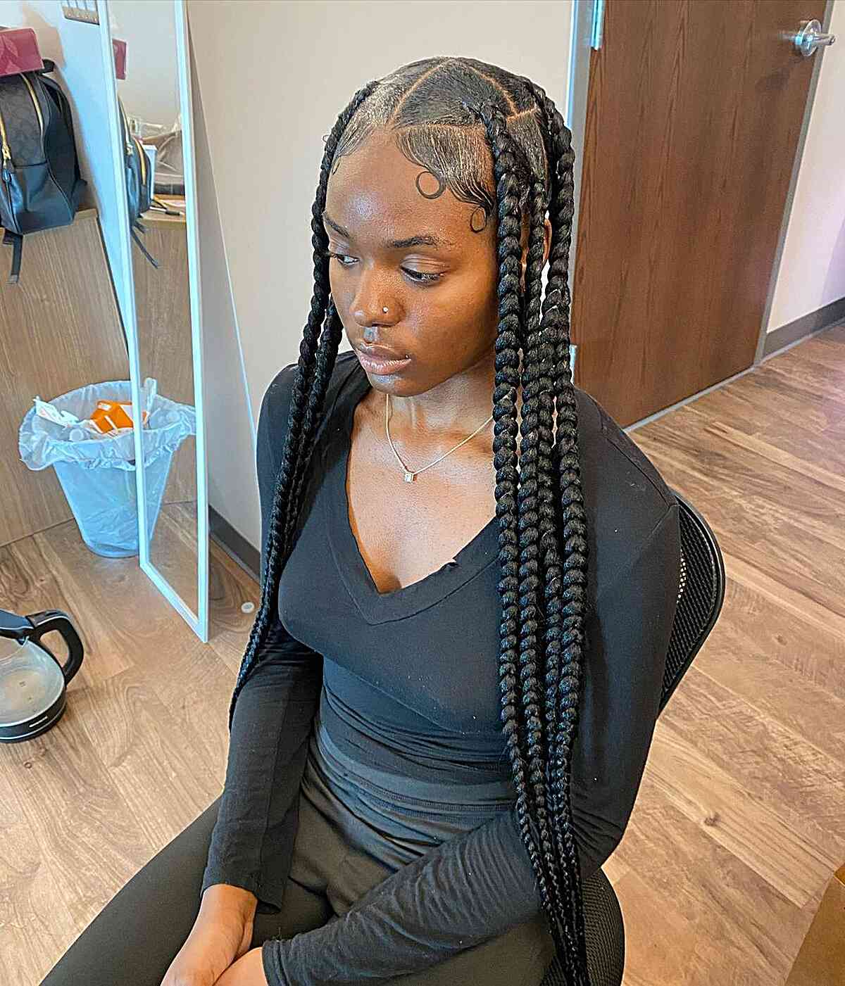 Long, wide braids without knots, styled in the center, with smooth edges